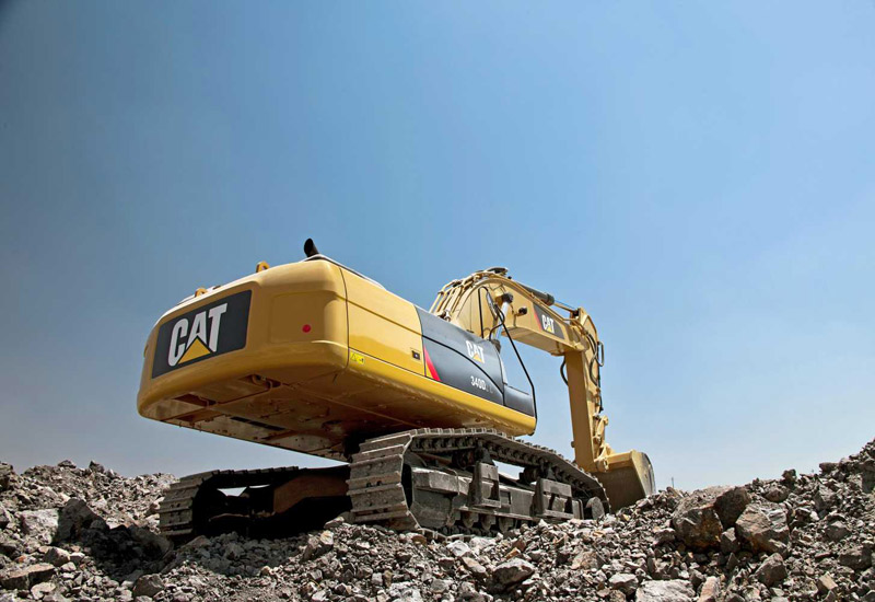 Caterpillar cuts abroad but invests in Middle East