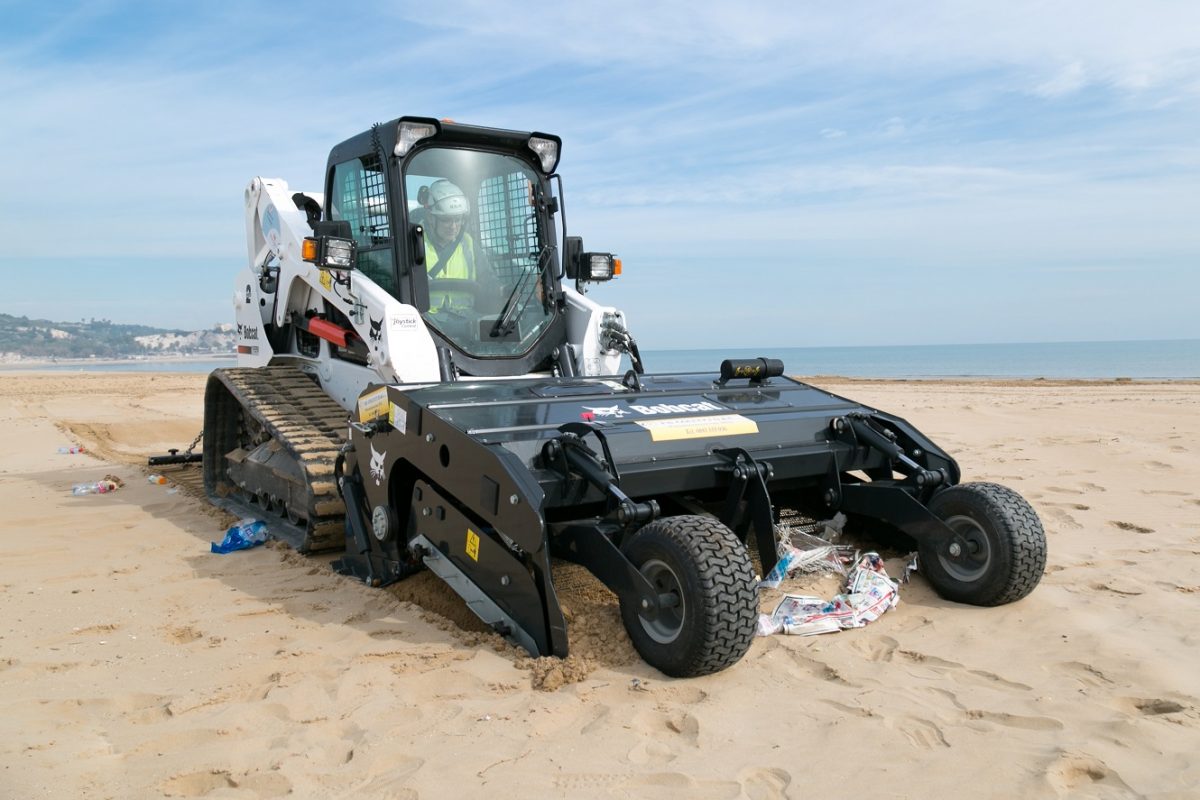 Bobcat sand cleaner removes waste and debris at beach in Italy