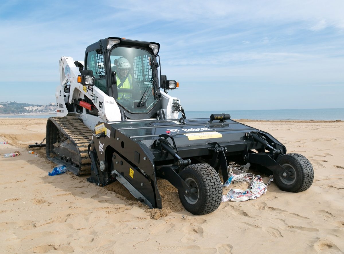 Bobcat sand cleaner removes waste and debris at beach in Italy